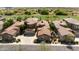 Aerial view of a neighborhood with a golf course in the background at 19550 N Grayhawk Dr # 1117, Scottsdale, AZ 85255