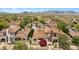 Gorgeous aerial view of neighborhood homes featuring desert landscaping and mountain views at 19550 N Grayhawk Dr # 1117, Scottsdale, AZ 85255