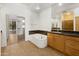 Well-appointed bathroom features a soaking tub, spacious vanity, and a view to a walk-in closet at 19550 N Grayhawk Dr # 1117, Scottsdale, AZ 85255