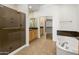 Elegant bathroom boasts a soaking tub, walk-in shower, and stylish vanity with granite countertop at 19550 N Grayhawk Dr # 1117, Scottsdale, AZ 85255