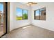 Sunlit bedroom features large windows with desert views, creating a bright and airy atmosphere at 19550 N Grayhawk Dr # 1117, Scottsdale, AZ 85255