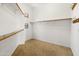 Spacious walk-in closet with ample shelving and rod space for organized storage at 19550 N Grayhawk Dr # 1117, Scottsdale, AZ 85255