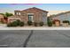 Charming single-Gathering home featuring stone accents, desert landscaping, and a well-maintained front yard at 19550 N Grayhawk Dr # 1117, Scottsdale, AZ 85255