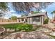 Enjoyable backyard with a lush lawn, string lights, mature trees, and convenient basketball hoop at 20626 N 5Th Ave, Phoenix, AZ 85027