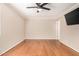 Comfortable bedroom with hardwood floors, a ceiling fan, and ample natural light at 20626 N 5Th Ave, Phoenix, AZ 85027