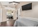Bedroom featuring closet with mirrored doors, laminate flooring, and vaulted ceilings at 20626 N 5Th Ave, Phoenix, AZ 85027