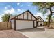 Exterior of a well-maintained home featuring a two-car garage and gravel landscaping at 20626 N 5Th Ave, Phoenix, AZ 85027
