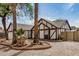 Charming Tudor-style home with mature palm trees and low-maintenance gravel landscaping at 20626 N 5Th Ave, Phoenix, AZ 85027