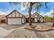 Inviting home with a two-car garage, desert landscaping, and a well-kept lawn at 20626 N 5Th Ave, Phoenix, AZ 85027