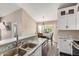 Bright kitchen featuring granite countertops, stainless steel appliances, and an adjacent dining area with natural light at 20626 N 5Th Ave, Phoenix, AZ 85027