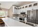 Modern kitchen with stainless steel appliances, granite countertops, and white cabinets at 20626 N 5Th Ave, Phoenix, AZ 85027