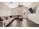Cozy living room with a large sectional sofa, vaulted ceiling, and modern ceiling fan at 20626 N 5Th Ave, Phoenix, AZ 85027