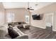 Open-concept living room with vaulted ceilings, modern ceiling fan, and vinyl flooring at 20626 N 5Th Ave, Phoenix, AZ 85027