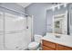 Bright bathroom featuring a glass shower enclosure, a toilet, and a vanity with sink at 21031 E Creekside Dr, Queen Creek, AZ 85142