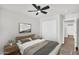 Cozy bedroom featuring a comfortable bed with neutral bedding and stylish decor at 21031 E Creekside Dr, Queen Creek, AZ 85142