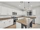 Well-appointed kitchen with white cabinets, granite countertops, and stainless steel appliances at 21031 E Creekside Dr, Queen Creek, AZ 85142