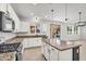 Spacious kitchen with a center island, granite counters, stainless steel appliances, and backyard views at 21031 E Creekside Dr, Queen Creek, AZ 85142