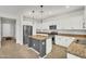 Modern kitchen with stainless steel appliances, granite countertops, and ample cabinet space at 21031 E Creekside Dr, Queen Creek, AZ 85142