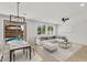 Elegant living room with comfortable seating, views of the pool, and contemporary decor at 21031 E Creekside Dr, Queen Creek, AZ 85142