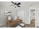 Home office with neutral walls, ceiling fan, and desk, offering a workspace at 21031 E Creekside Dr, Queen Creek, AZ 85142