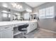 Elegant bathroom features a vanity with great lighting, drawers and a comfortable stool at 214 W Beverly Ln, Phoenix, AZ 85023
