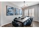 Dining room showcases stylish lighting and modern artwork, seating for eight at 214 W Beverly Ln, Phoenix, AZ 85023