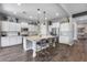 Bright kitchen features a large central island, stainless steel appliances and white cabinetry at 214 W Beverly Ln, Phoenix, AZ 85023