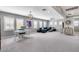 Expansive living room with plush gray carpet, statement lighting, and a comfortable blue sofa set at 214 W Beverly Ln, Phoenix, AZ 85023