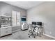 Clean home office with neutral decor, a modern desk and storage shelves at 214 W Beverly Ln, Phoenix, AZ 85023