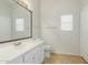 Clean bathroom featuring a vanity with a large mirror and tile flooring at 21621 N 48Th Pl, Phoenix, AZ 85054
