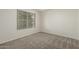 Bedroom with ceiling fan and neutral carpeting at 21621 N 48Th Pl, Phoenix, AZ 85054