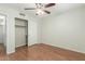 The bedroom has wood flooring and ample closet space at 21621 N 48Th Pl, Phoenix, AZ 85054