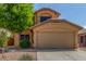 Charming two-story home featuring a stucco facade, well-maintained landscaping, and a two-car garage at 21621 N 48Th Pl, Phoenix, AZ 85054