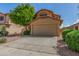Charming two-story home featuring a stucco facade, well-maintained landscaping, and a two-car garage at 21621 N 48Th Pl, Phoenix, AZ 85054