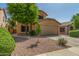 Charming two-story home featuring a stucco facade, well-maintained landscaping, and a two-car garage at 21621 N 48Th Pl, Phoenix, AZ 85054