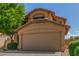 Charming two-story home featuring a stucco facade, well-maintained landscaping, and a two-car garage at 21621 N 48Th Pl, Phoenix, AZ 85054