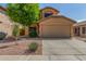 Charming two-story home featuring a stucco facade, well-maintained landscaping, and a two-car garage at 21621 N 48Th Pl, Phoenix, AZ 85054
