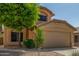Charming two-story home featuring a stucco facade, well-maintained landscaping, and a two-car garage at 21621 N 48Th Pl, Phoenix, AZ 85054