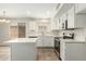 Kitchen featuring white cabinets, stainless steel appliances, and an island at 21621 N 48Th Pl, Phoenix, AZ 85054