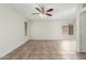 Expansive living area with tile flooring, ceiling fan and lots of natural light at 21621 N 48Th Pl, Phoenix, AZ 85054