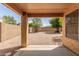 Covered patio overlooks a spacious backyard with desert landscaping at 21621 N 48Th Pl, Phoenix, AZ 85054