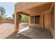 Covered patio overlooks a spacious backyard with desert landscaping at 21621 N 48Th Pl, Phoenix, AZ 85054
