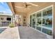 Stunning patio with large sliding glass doors that open to an outdoor kitchen, bar and pool at 22346 N 104Th Ln, Peoria, AZ 85383