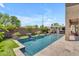 Inviting pool with seating and landscaped yard, perfect for relaxing and entertaining at 22346 N 104Th Ln, Peoria, AZ 85383
