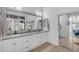 Stylish bathroom features dual sinks, framed mirrors, and updated cabinetry at 22346 N 104Th Ln, Peoria, AZ 85383
