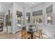 Bright breakfast nook features a round table and backyard access with views of the pool at 22346 N 104Th Ln, Peoria, AZ 85383