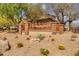 Welcoming entrance to Casa Del Rey with lush desert landscaping at 22346 N 104Th Ln, Peoria, AZ 85383