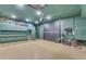 Organized garage with ample storage, workspace, and modern lighting at 22346 N 104Th Ln, Peoria, AZ 85383