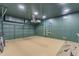 Spacious garage with custom epoxy floor, storage, and modern lighting at 22346 N 104Th Ln, Peoria, AZ 85383