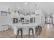 Spacious kitchen with an island, stainless steel appliances, white cabinets, and plenty of counter space at 22346 N 104Th Ln, Peoria, AZ 85383